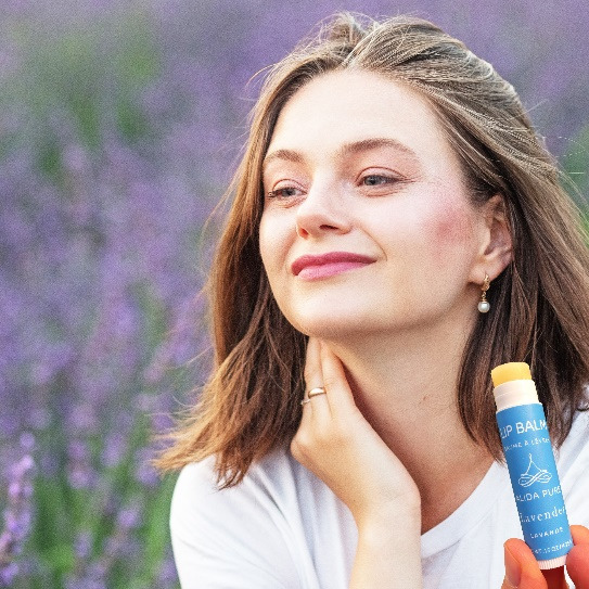 a woman with lavender lip balm